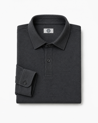 Folded dark gray polo shirt with a brand label on a white background