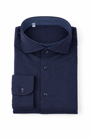 Folded navy blue shirt on a white background