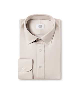 Beige dress shirt on a white background